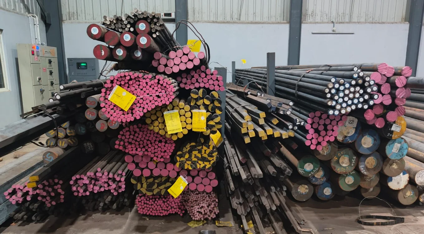 Color-tagged steel stock organized in warehouse
